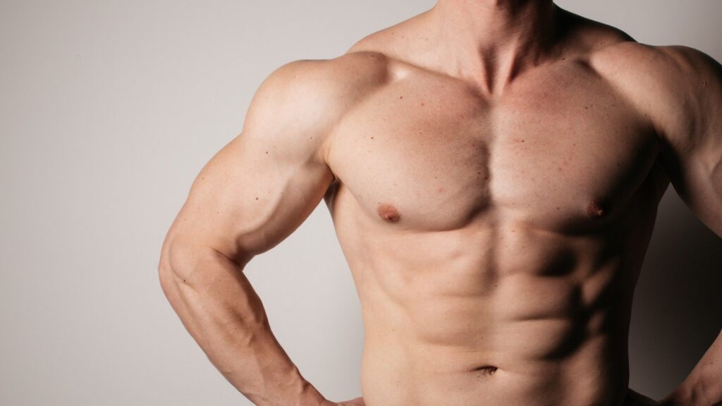 Build strong, supple shoulders using this 1 move — I’ve taught weightlifting and mobility for years, and it rarely fails Up close image of male topless showing muscles