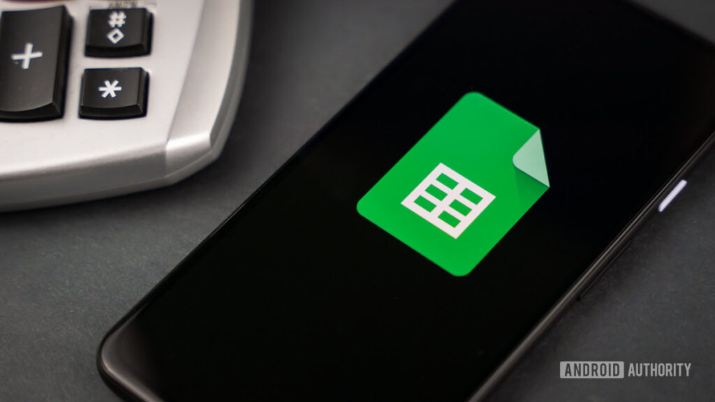 Gemini can now help you fix those broken Google Sheets formulas Google Sheets next to calculator stock photo 2