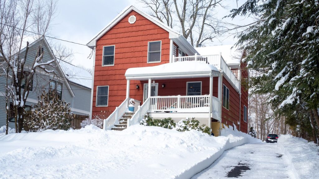 That snow on your roof weighs more than you think — here's how to remove it safely