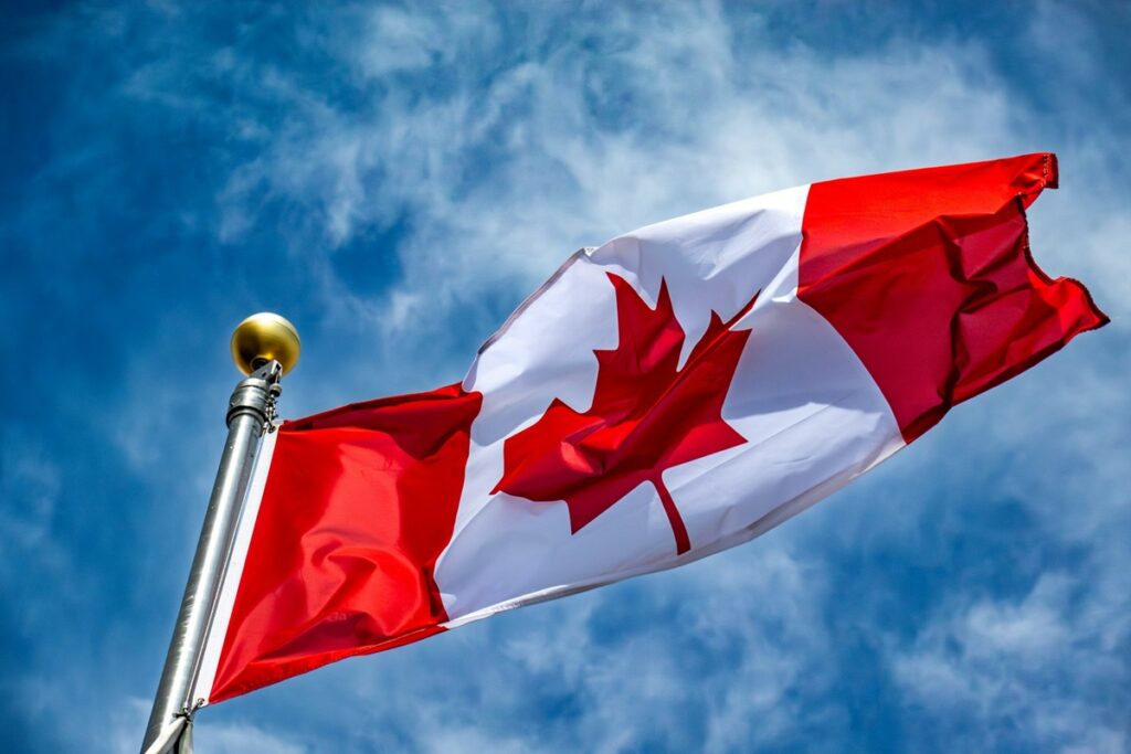 Alberta iGaming rollout raises First Nations concerns Canadian flag flying from a flagpole.