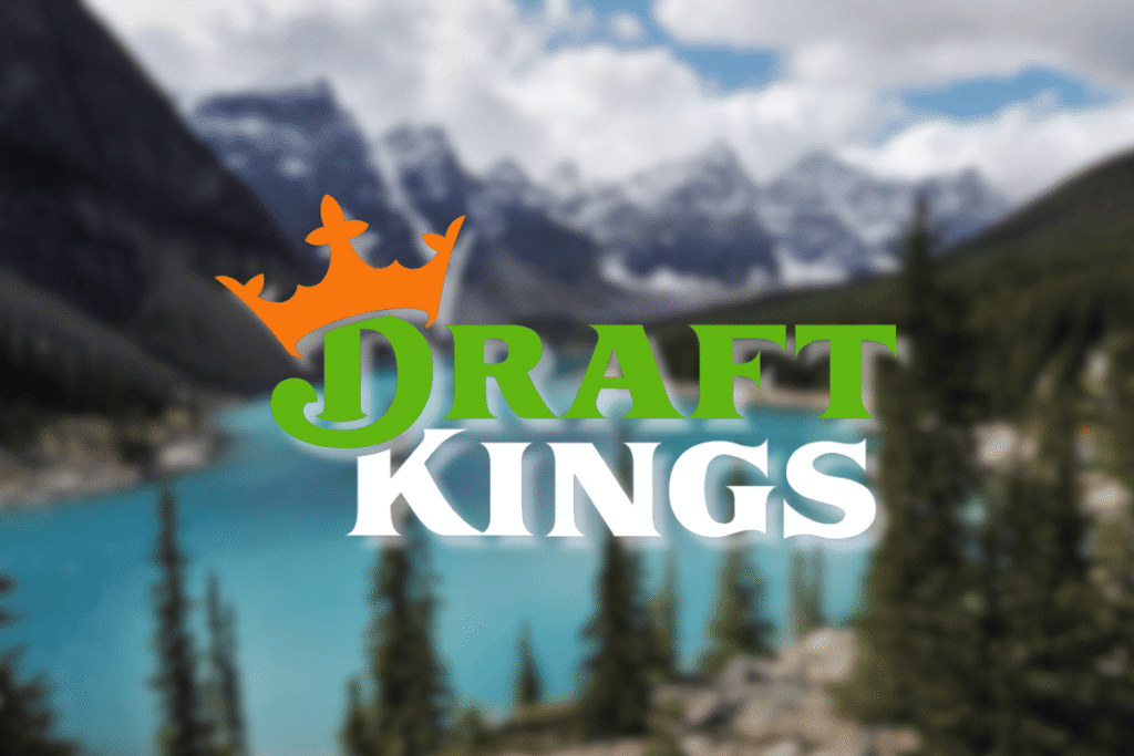 DraftKings logo over Canadian Rocky Mountains lake landscape representing DraftKings Alberta Canada online sports betting and casino expansion