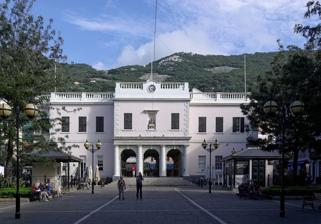 Gibraltar Licenses First Prediction Markets Operator Amid Gambling Shift An exterior view of the Gibraltar Parliament building.