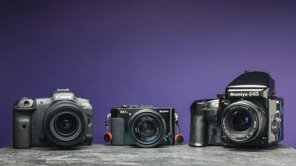 I Learned Every Photographer Needs These 3 Types of Cameras An image of three cameras with a purple background