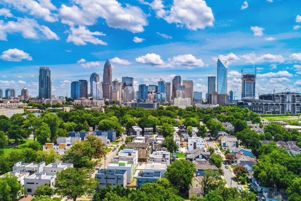 Charlotte North Carolina skyline with Bank of America Stadium and Uptown cityscape viewed over residential neighborhood on sunny day. Lumbee Council advances gaming amendment in North Carolina, sending measure to tribal voters soon