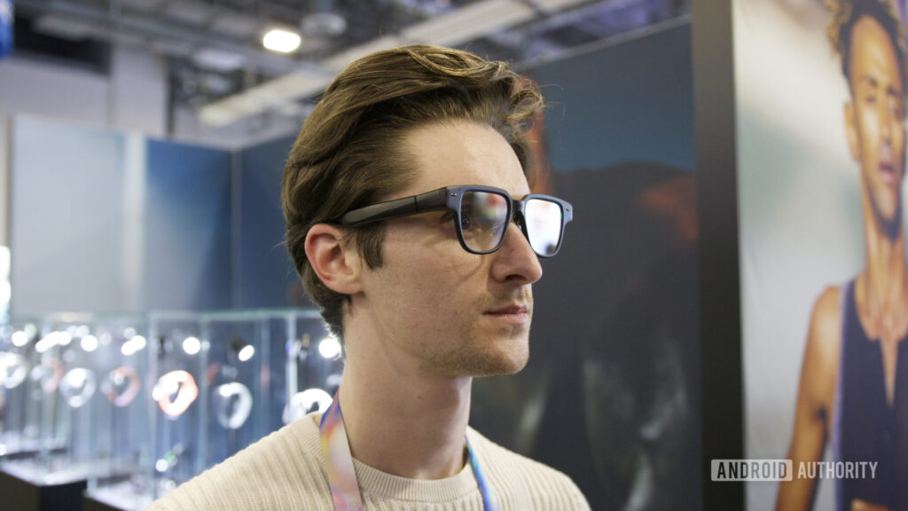 These smart glasses are adopting one of the worst trends in tech Someone wearing the Amazfit Helio smart glasses at CES 2026.