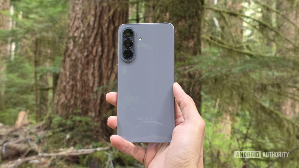 Easy to like, harder to justify Samsung Galaxy A57 review image showing the phone's back in an outdoor setting