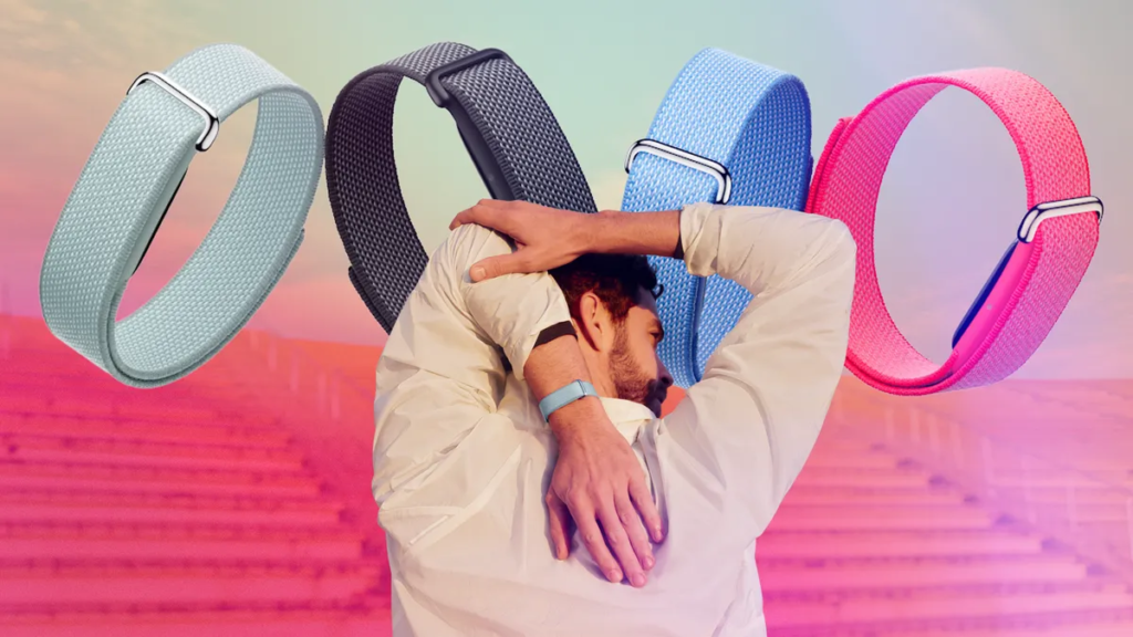A Fitbit Air user faces away as they reach behind them. A band is visible on their left wrist. In the background are four Fitbit Airs in the four available colors.