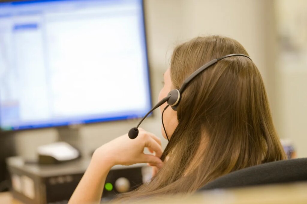 Get ready for the whisper-filled office of the future A photo of a call center representative taken from behind, used in a post about Operative Intelligence