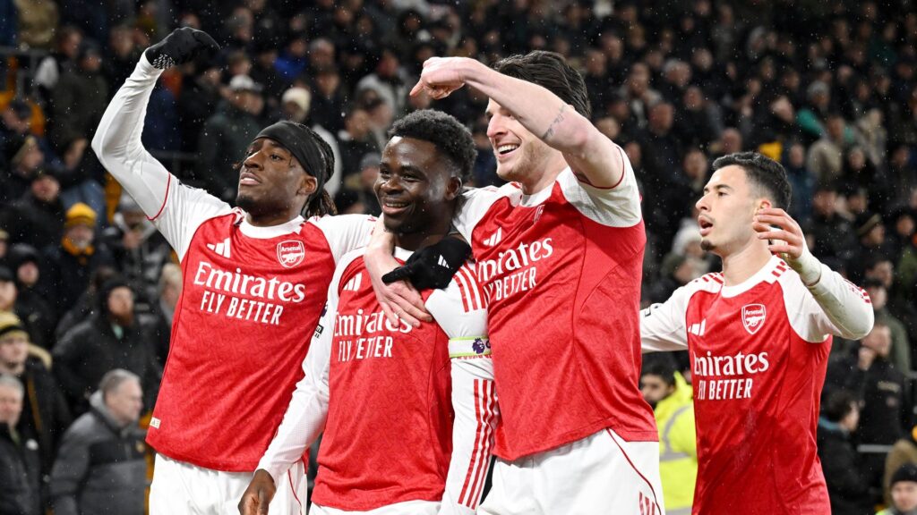 Bukayo Saka of Arsenal celebrates with teammates after scoring a goal in the Premier League 2025/26.