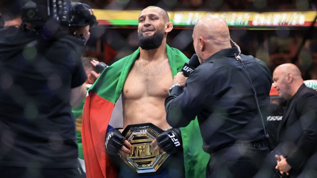 Khamzat Chimaev posing with the UFC middleweight belt