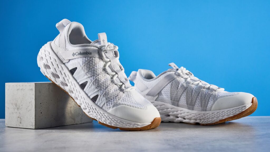I’ve been testing the Columbia Drainmaker hybrid sneakers for a month — here are 3 things I think and 1 thing I don’t Columbia Drainmaker in white photographed in front of a blue background