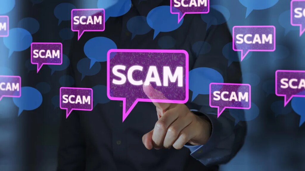 Online Job Scams Are on the Rise, and Gen Z Is Struggling With Them, Study Says A man tapping on a scam message bubble