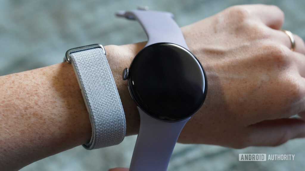 PSA: Don’t buy the Fitbit Air expecting it to work with your Charge or Versa A user wears a Google Fitbit Air and holds a Pixel Watch 4 alongside it.