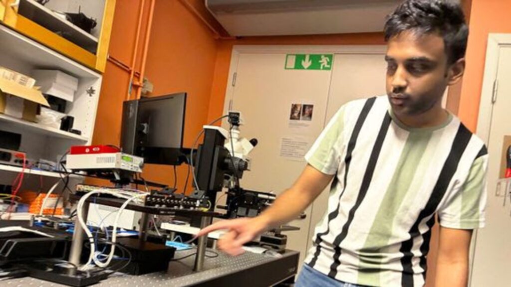 Govind Krishna shows the setup for the integrated photonic circuit that works "a bit like a programmable railway junction for quantum light".