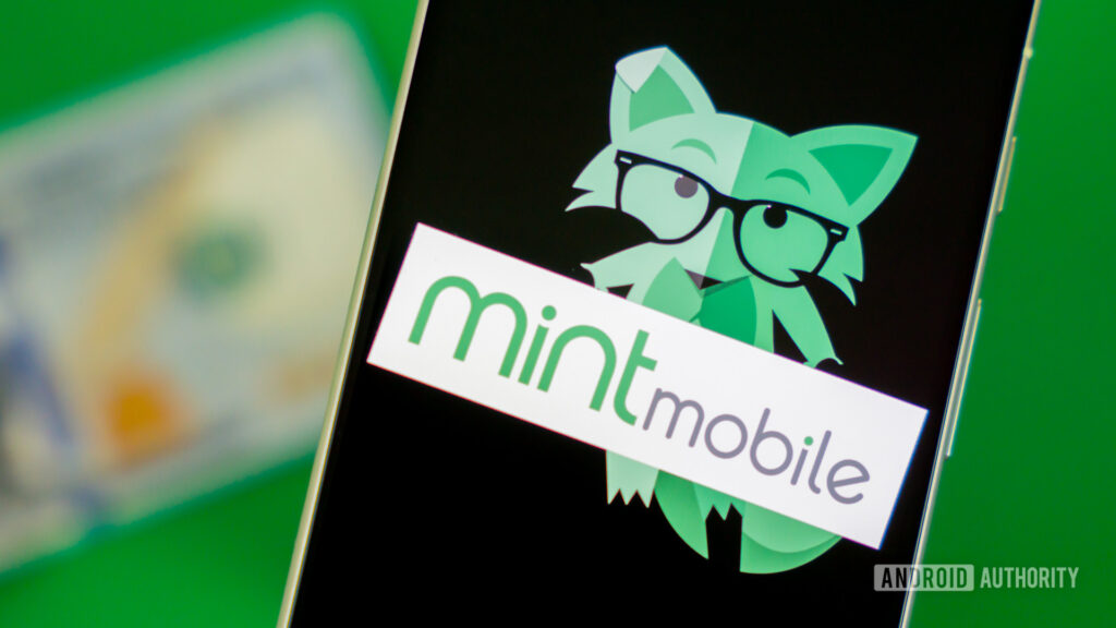 Switching to this carrier could save me half of my already affordable cellular plan Stock photo of Mint Mobile fox on phone with money 1
