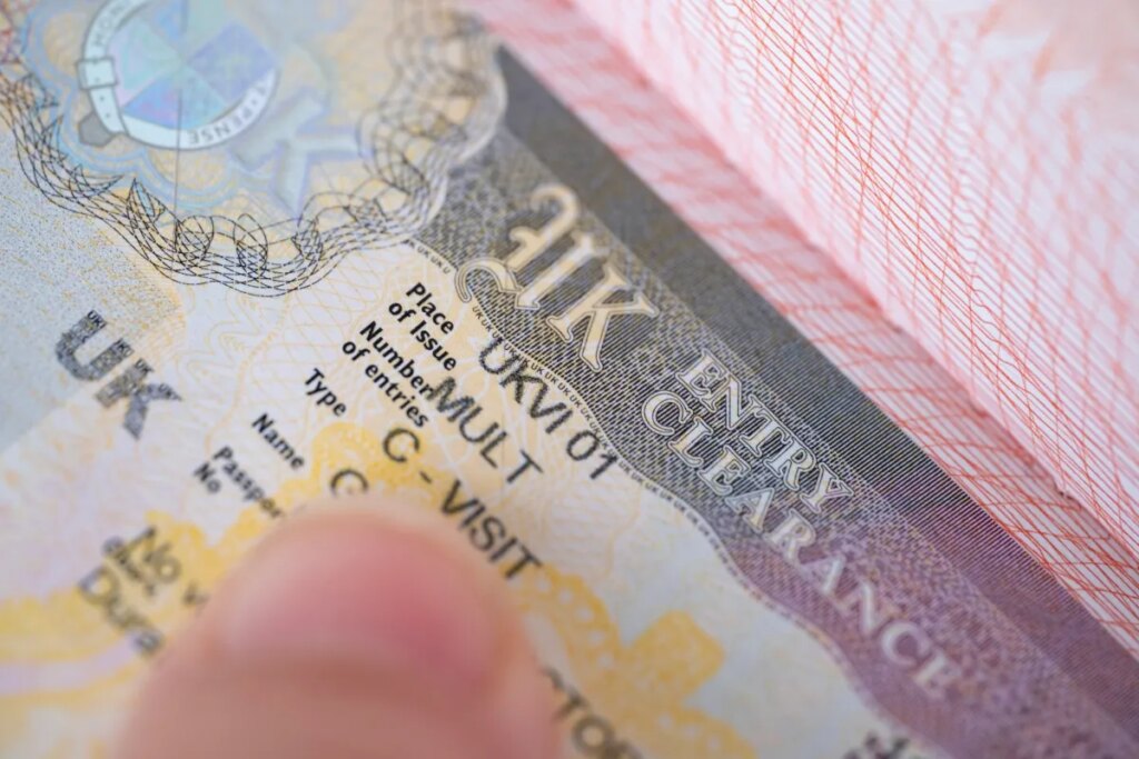 a close-up shot of a UK visa in someone's passport.