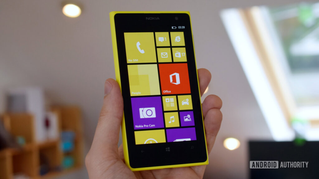 Using Windows Phone in 2026 reminded me just how badly I miss it Nokia Lumia 1020 Pureview in hand showing the home page