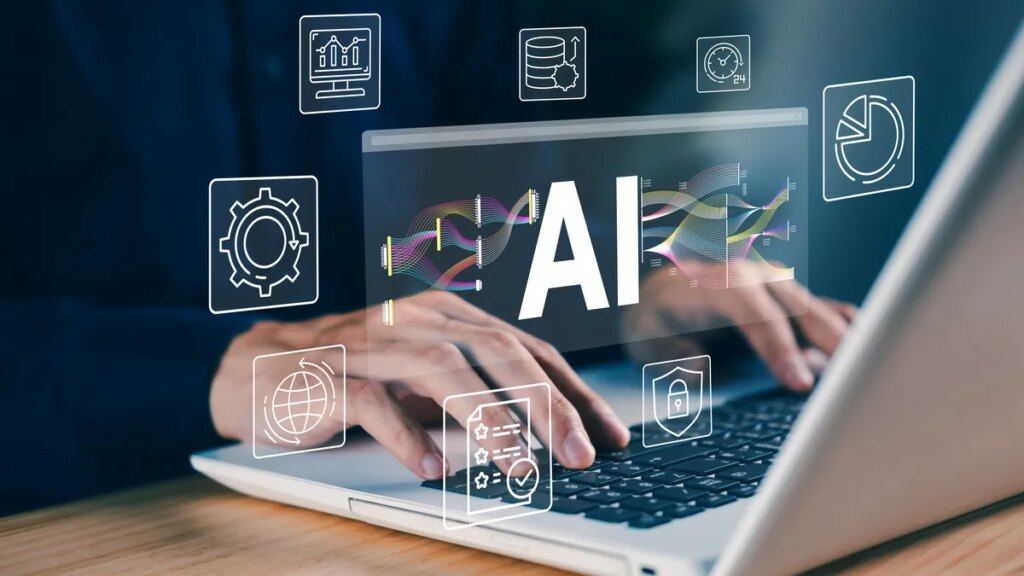 Man typing at laptop with AI hologram above it