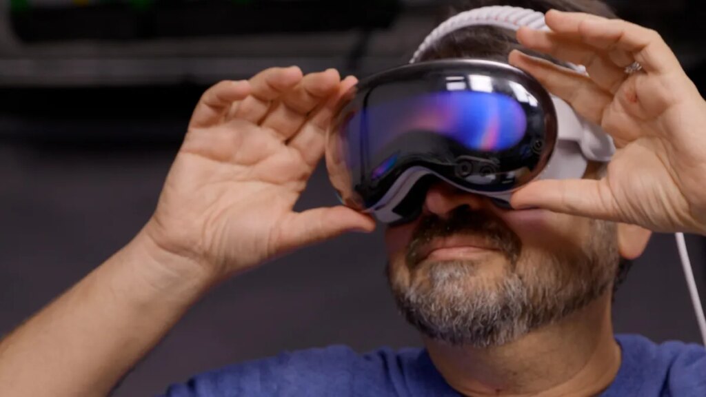 Apple’s Vision Pro Sees the World With AI In VisionOS 27 CNET's Scott Stein wearing Vision Pro headset on his face