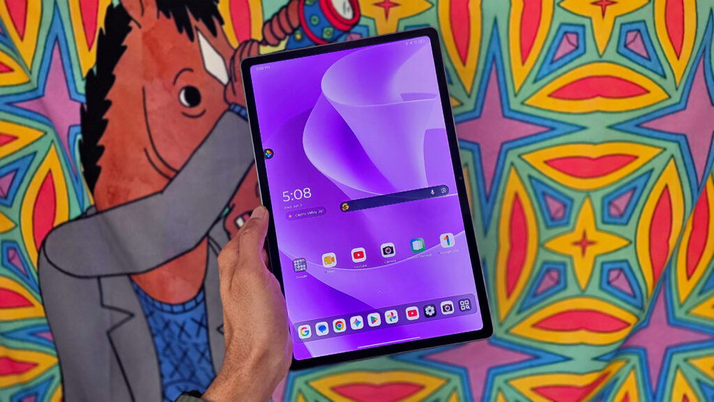 Budget Android tablet contender for under $300 Lenovo Idea Tab Plus review image showing the tablet in hand against a colorful backdrop