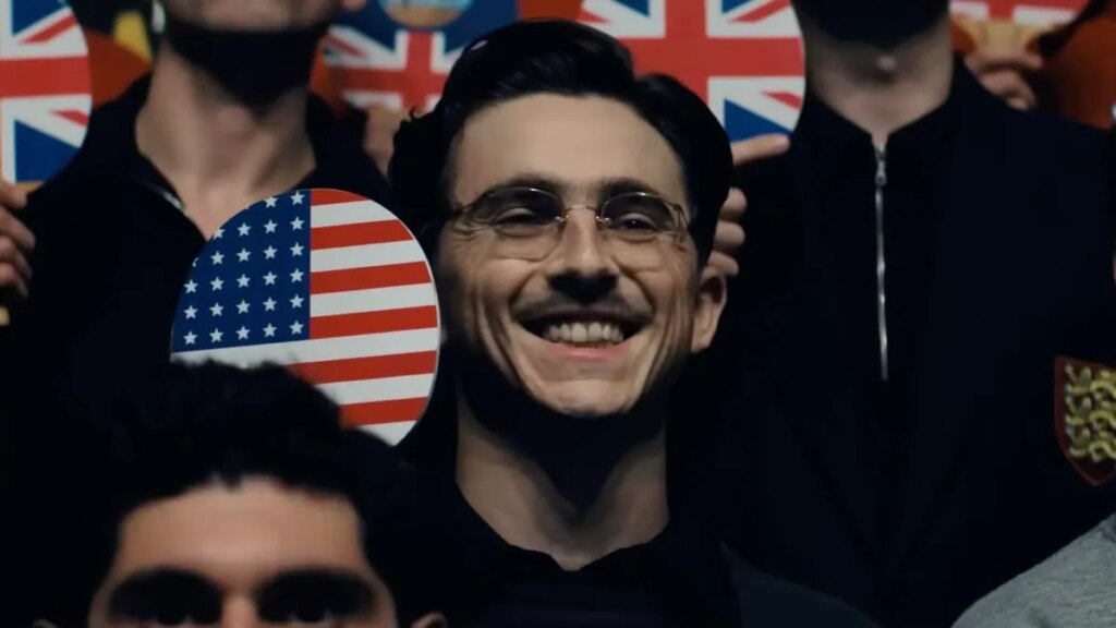 Google DeepMind Partners With Hollywood Indie Darling A24 to Develop AI Filmmaking Tools actor Timothée Chalamet smiles and holds a ping pong paddle in the film Marty Supreme