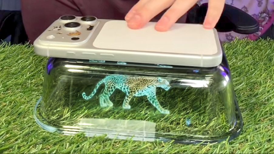 I tried the viral phone hologram hack: Here’s the result Screenshot of TikTok video showing DIY hologram projector using your phone and a rectangular glass dish.