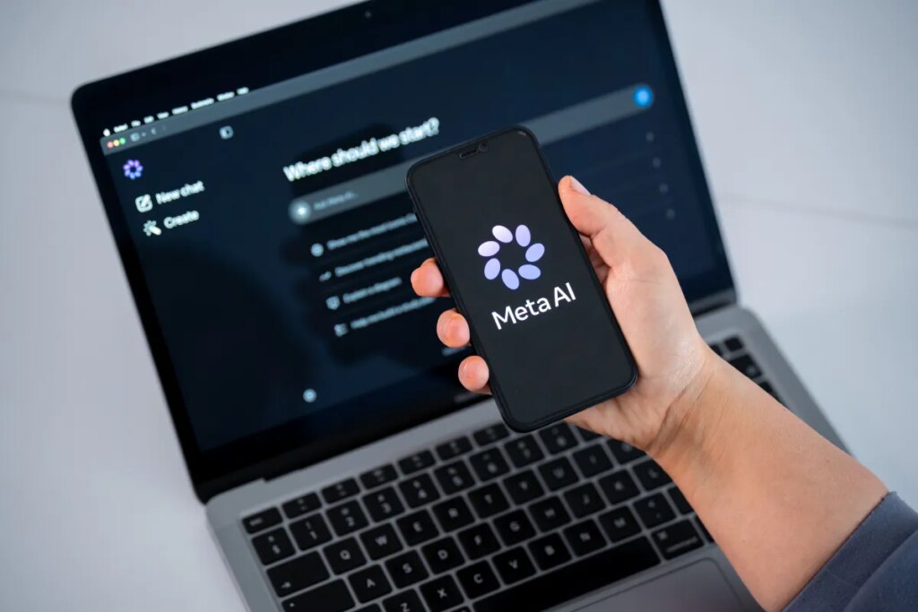 Instagram is alerting users who were targeted by hackers during AI chatbot attacks The Meta AI logo is seen on a smartphone screen, and a chatbot website is displayed on a computer screen.