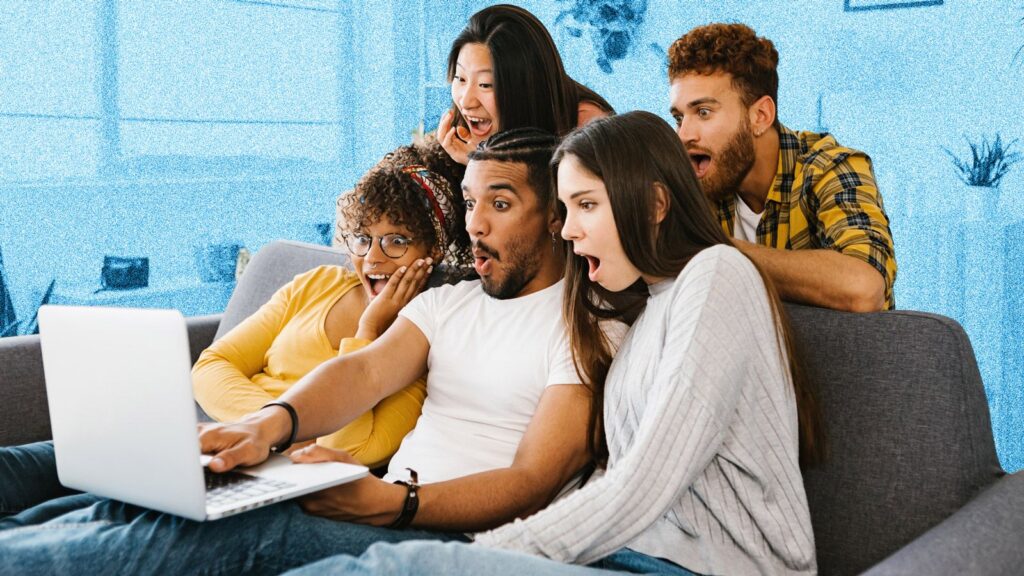 NBN prices are set to increase in less than 2 weeks — lock in a low-cost plan now before it’s too late A group of young people sitting on a sofa around a laptop screen, all looking shocked and surprised.