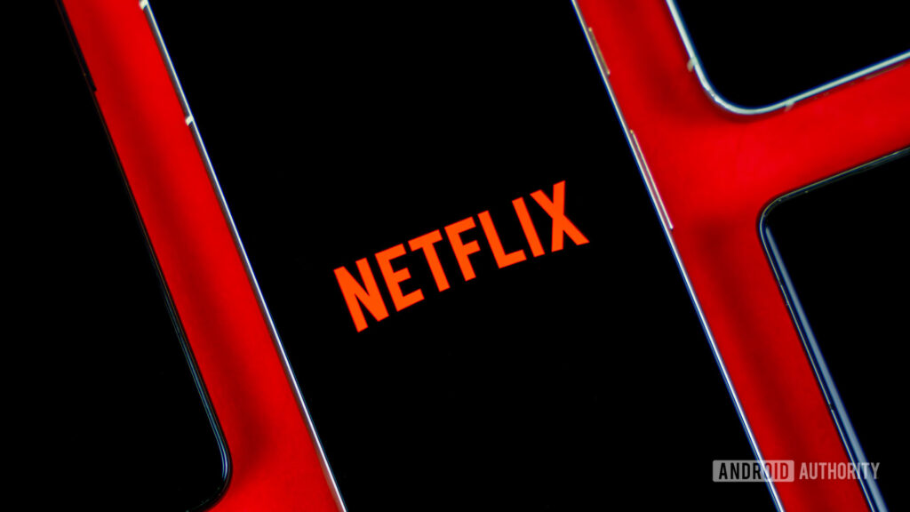 Netflix is changing how households log into shared accounts, and you probably won’t like it Netflix logo on smartphone, next to other devices stock photo (2)