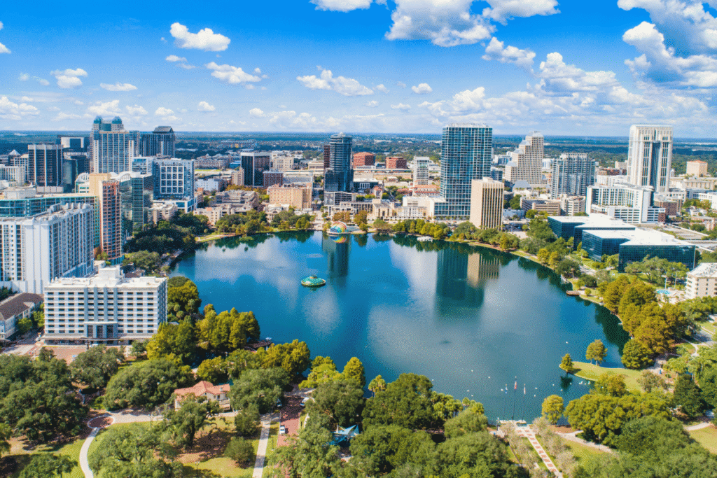 Seminole gaming overhaul permit ruling upheld in Florida Aerial view of downtown Orlando, Florida skyline surrounding Lake Eola under a bright blue sky with modern skyscrapers and waterfront parks. Florida appeals court upholds permit revocation amid Seminole gaming overhaul