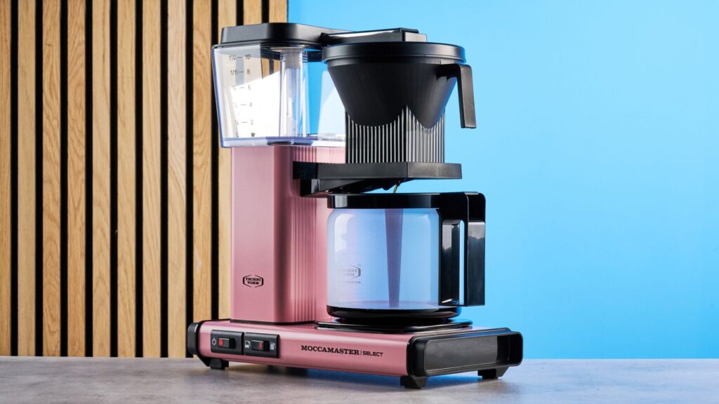 The Moccamaster is the perfect example of ‘buy it nice or buy it twice’ — I did the coffee math vs Bonavita, Breville and more so you don’t have to the technivorm moccamaster kgbv select in pink photographed against the blue tom's guide background