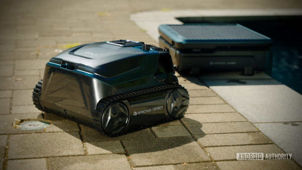 The WYBOT S3 is a smart pool robot that doesn’t need constant attention WYBOT S3 robot pool cleaner parked beside its solar charging station