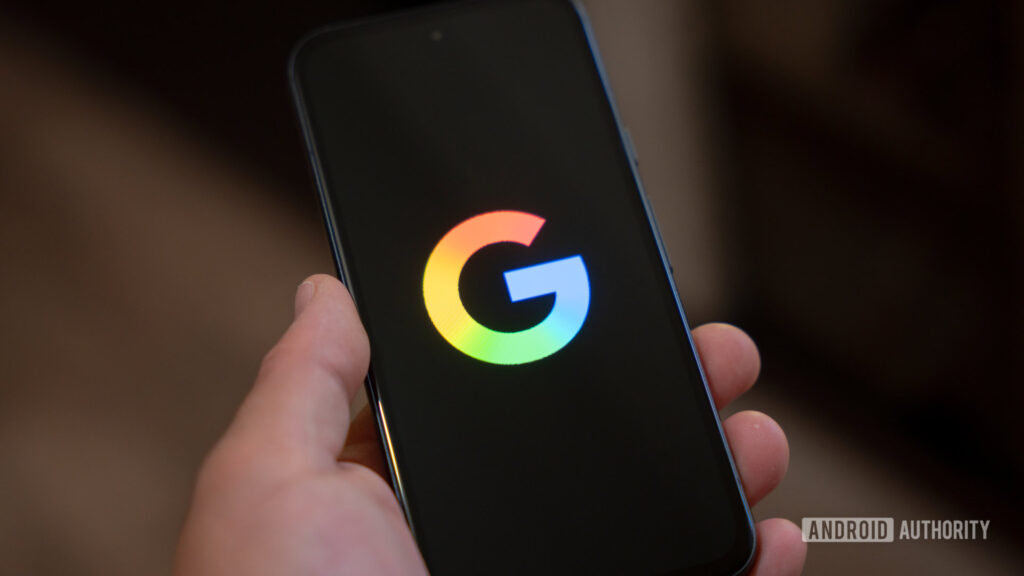 Google logo on smartphone stock photo 1