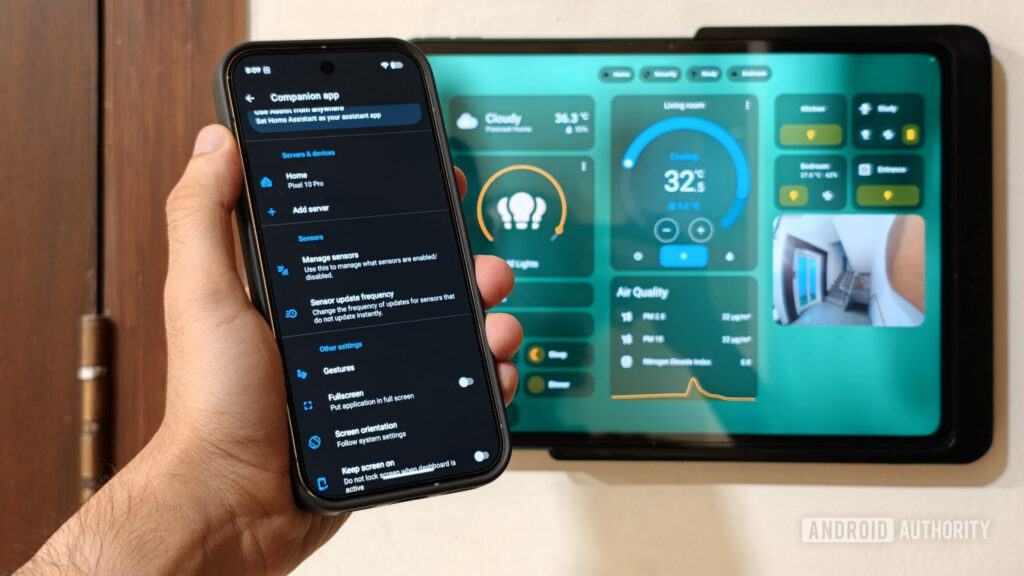 HomeAssistant app on phone with dashboard in background
